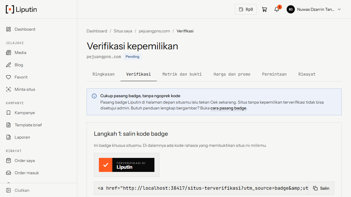 Halaman verifikasi kepemilikan situs di akun Liputin, menampilkan badge dan kode untuk disalin